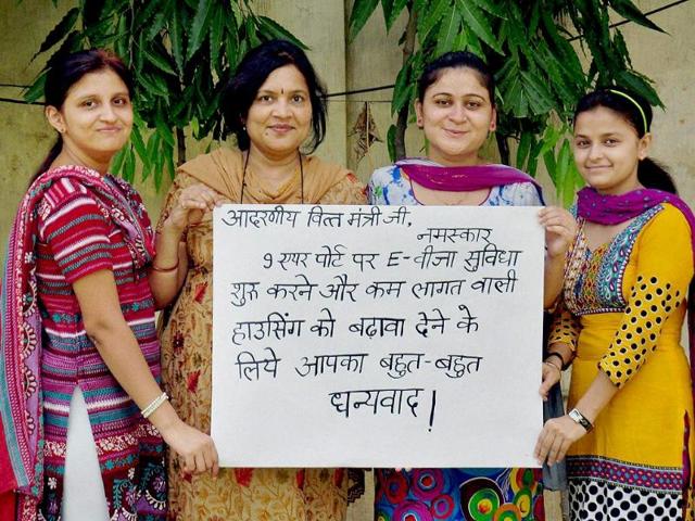 Women express gratitude to finance minister Arun Jaitley for the e-visa announcements in the budget, in Moradabad. (PTI photo)