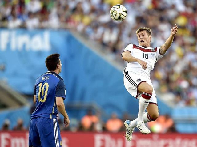 Germany's Toni Kroos (18) rises above Argentina's Lionel Messi (10) to head the ball during the Fifa World Cup final match between Germany and Argentina at the Maracana Stadium in Rio de Janeiro, Brazil. (AP Photo)