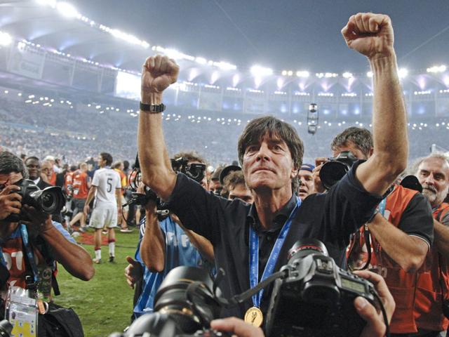 Germany's head coach Joachim Loew celebrates during a victory lap after the World Cup final soccer match between Germany and Argentina on July 13, 2014. Germany won the match 1-0. (AP Photo/Matthias Schrader)
