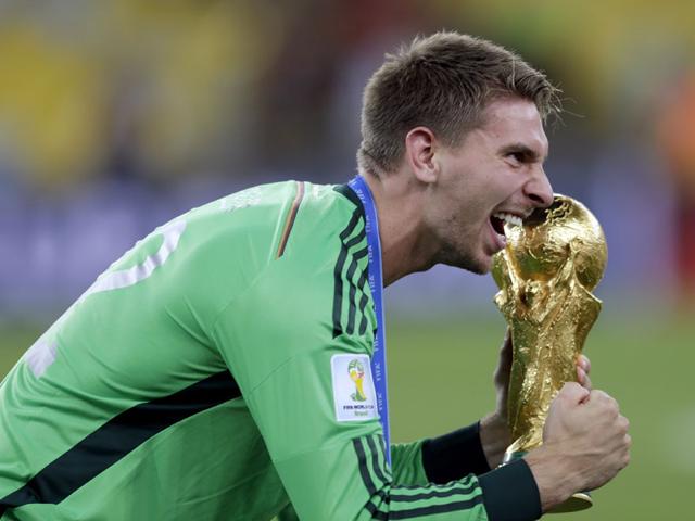 Germany's goalkeeper Ron-Robert Zieler celebrates with the World Cup trophy following their 1-0 victory over Argentina after the World Cup final between Germany and Argentina in Rio de Janeiro, Brazil on July 13, 2014. (AP Photo/Natacha Pisarenko)