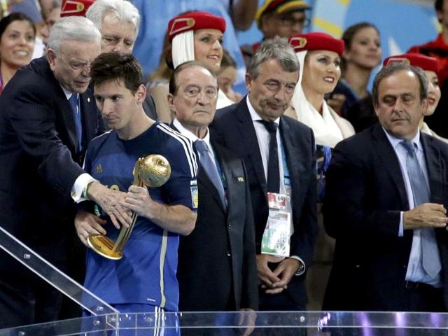 Argentina's Lionel Messi walks away after receiving the Golden Ball trophy following Germany's 1-0 victory over Argentina after the World Cup final football match between Germany and Argentina on July 13, 2014. (AP Photo/Felipe Dana)