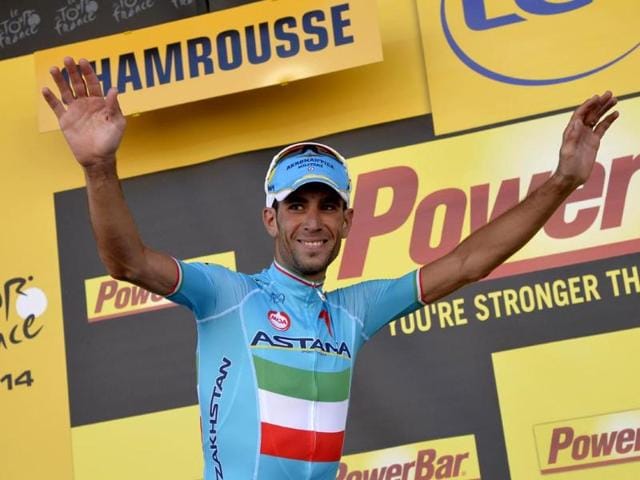 Stage-winner-Italy-s-Vincenzo-Nibali-celebrates-on-the-podium-after-winning-the-197-5-km-thirteenth-stage-of-the-101st-Tour-de-France-AFP-Photo