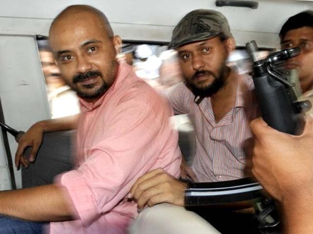 AAP-members-Dilip-Pandey-left-and-Javed-Ahmed-being-taken-to-Saket-Court-in-New-Delhi-on-Saturday-Sushil-Kumar-HT