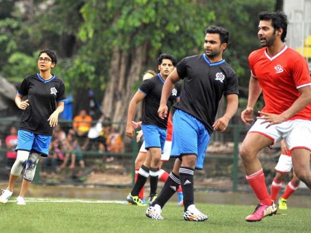 Bollywood film director Kiran Rao, (L), film actors Sachin Joshi and Sabbir Ahluwalia (R) play during a charity football match organized by Ira Khan, daughter of film actor Aamir Khan in Mumbai on July 20, 2014. (AFP)