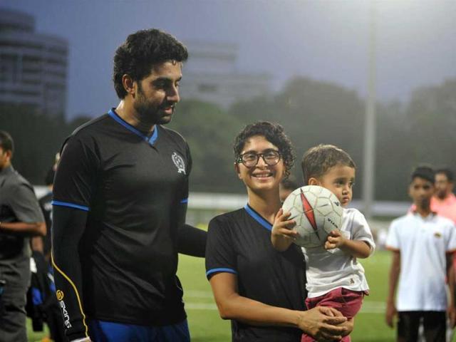 Actor Abhishek Bachchan and Aamir Khan's wife and Bollywood filmmaker Kiran Rao with her son Azad during the celebrity football match organized by Aamir Khan`s daughter Ira Khan at Cooperage ground in Mumbai. (IANS)