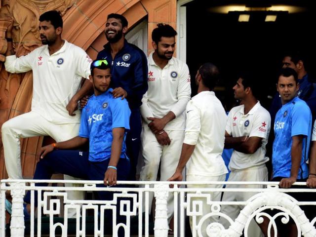 India's players watch the presentations from the dressing room balcony after they won the second cricket test match against England at Lord's cricket ground in London (Reuters Photo)