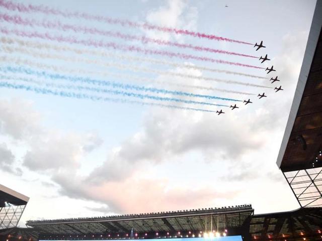 An aeronautics team flies past during the opening ceremony (AFP Photo)