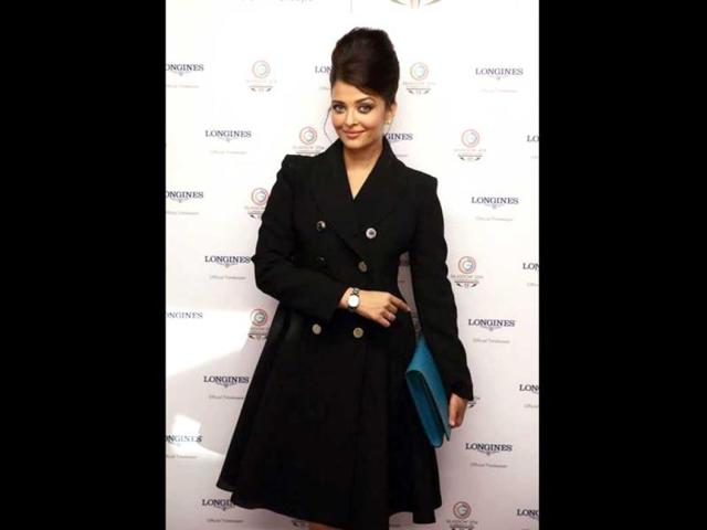 Aishwarya Rai Bachchan attended the opening ceremony of the Commonwealth Games in Glasgow, Scotland, on Wednesday. The actor, who was there to endorse a lifestyle brand, sported a black trench coat with a retro bouffant and matching boots. She carried an oversized blue clutch and posed generously for shutterbugs. (Aishwarya Rai-FC/Twitter)