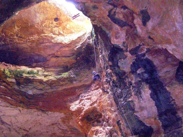 Cave-specialist-Bryan-McKenzie-rappels-into-Natural-Trap-Cave-in-north-central-Wyoming-The-cave-holds-the-remains-of-tens-of-thousands-of-animals-including-many-now-extinct-species-AP-Photo