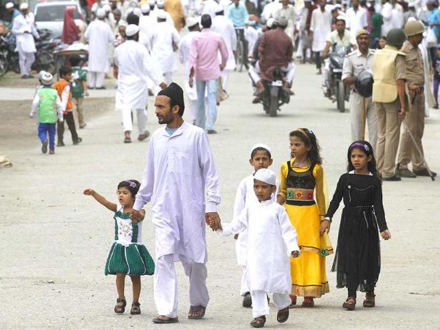 Muslims celebrate after offering prayers during the festival of Eid al-fitr, marking the end of Ramzan in Saharanpur. (Virendra Singh Gosain/HT photo)