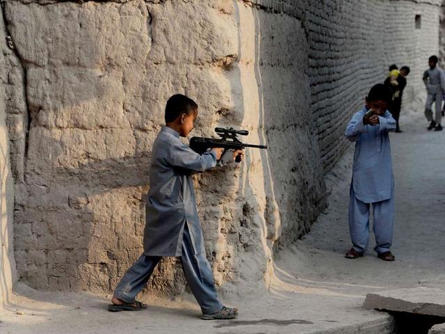 Afghan children play with plastic guns as they celebrate Eid ul-Fitr and the end of the fasting month of Ramadan in Jalalabad. (AFP photo)