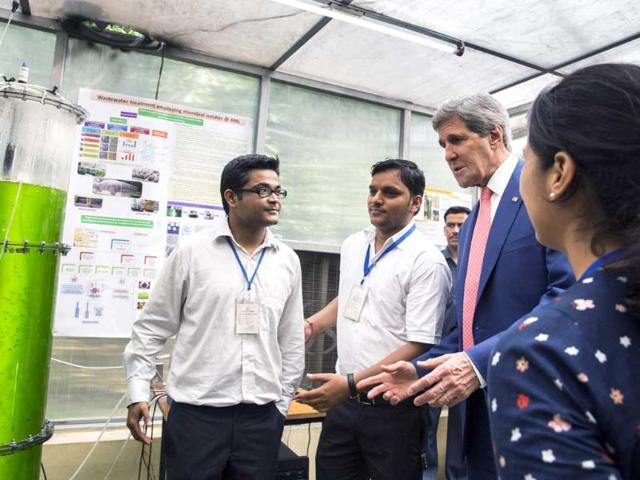 US secretary of state John Kerry speaks with graduate students about their work studying algae at the Indian Institute of Technology in New Delhi. AFP
