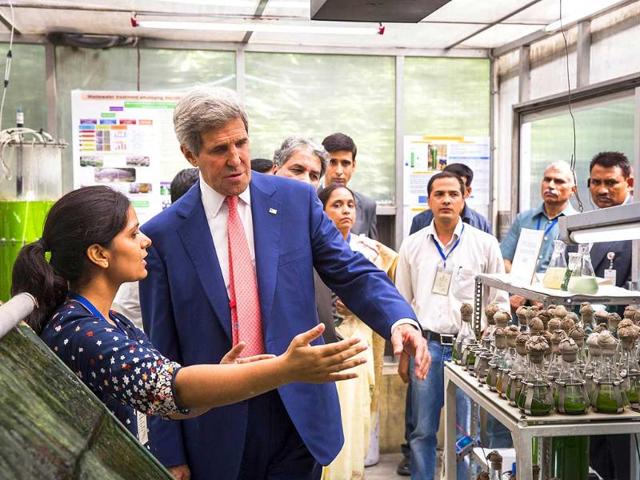 US secretary of state John Kerry speaks with graduate students about their work at the Indian Institute of Technology. AFP