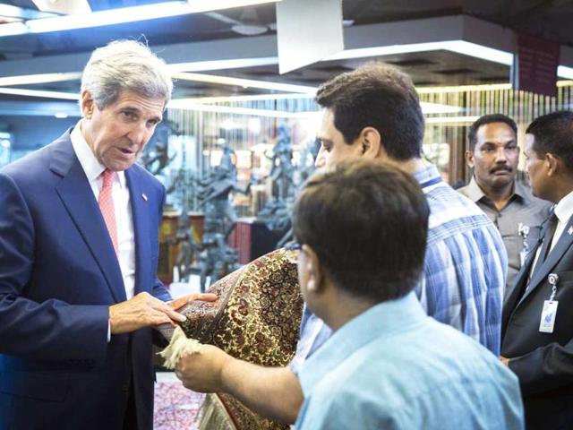 US secretary of state John Kerry visits the central cottage industries emporium marketplace in New Delhi. AFP