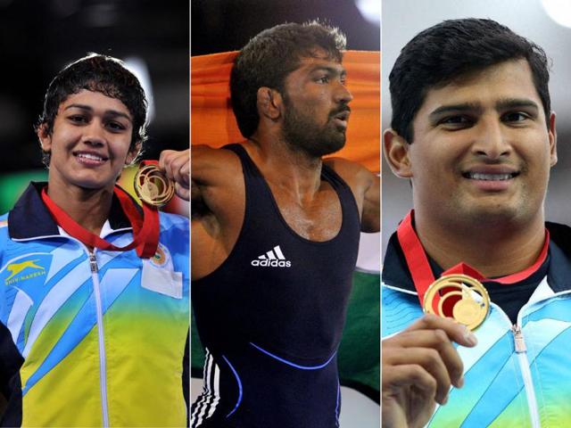 L-R-Wrestlers-Babita-Kumari-and-Yogeshwar-Dutt-and-discus-thrower-Vikas-Gowda-celebrate-their-wins-after-winning-gold-at-the-Commonwealth-Games-2014-in-Glasgow-Scotland-Agency-Photo L-R-Wrestlers-Babita-Kumari-and-Yogeshwar-Dutt-and-discus-thrower-Vikas-Gowda-celebrate-their-wins-after-winning-gold-at-the-Commonwealth-Games-2014-in-Glasgow-Scotland-Agency-Photo