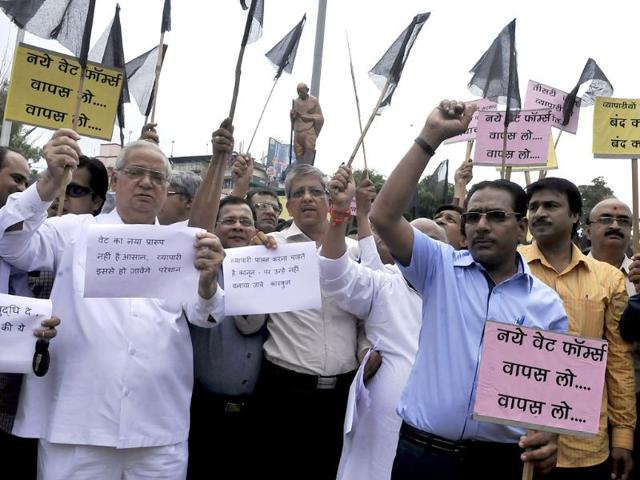 Traders protest against a new VAT form introduced in the state budget, in Indore on Thursday. (Arun Mondhe/HT photo)
