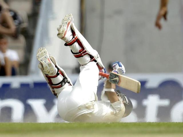 India's Ajinkya Rahane rolls on the pitch after diving to safely avoid being runout during the fifth and final day (AP Photo)