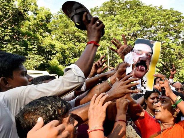 AIADMK-cadres-holding-a-protest-against-Sri-Lankan-President-Mahinda-Rajapakse-in-Chennai-PTI-photo