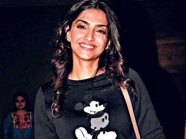Actor Sonam Kapoor ditches the glam doll look and goes old school with a Mickey Mouse print tee.