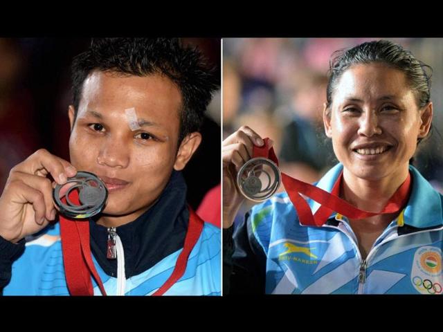 Boxers-Devendro-Singh-Laishram-L-and-Sarita-Devi-Laishram-with-their-silver-medals-at-the-2014-Commonwealth-Games-in-Glasgow-Scotland-Agency-Photo Boxers-Devendro-Singh-Laishram-L-and-Sarita-Devi-Laishram-with-their-silver-medals-at-the-2014-Commonwealth-Games-in-Glasgow-Scotland-Agency-Photo