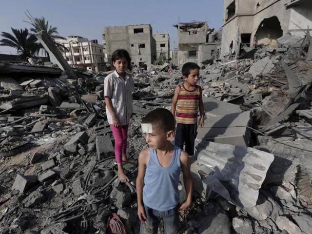 Palestinian-Seraj-Ismail-Abdel-Al-5-lightly-wounded-in-an-overnight-Israeli-strike-inspects-the-damage-to-several-buildings-in-Gaza-City-northern-Gaza-Strip-AP-photo Palestinian-Seraj-Ismail-Abdel-Al-5-lightly-wounded-in-an-overnight-Israeli-strike-inspects-the-damage-to-several-buildings-in-Gaza-City-northern-Gaza-Strip-AP-photo