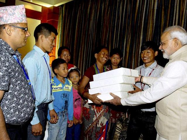 Prime Minister Narendra Modi meeting the family of Jeet Bahadur (2R) in Kathmandu, Nepal. (PTI photo)