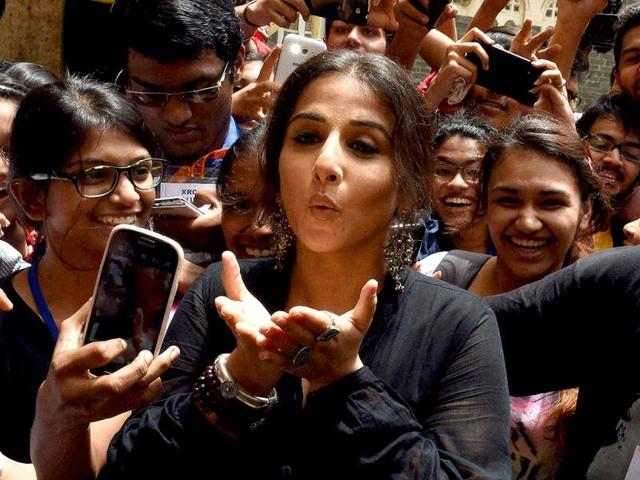 Blowing away troubles: Vidya Balan with students during distribution of smartcanes for the visually challenged. (PTI Photo)