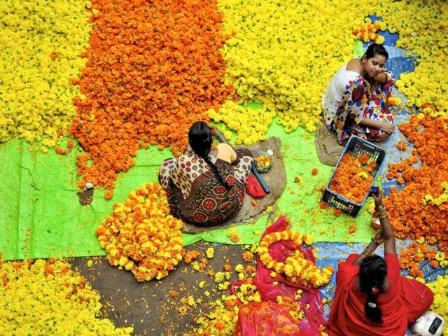 Vendors sit at a flower market in Bangalore. (Reuters/Abhishek N. Chinnappa)