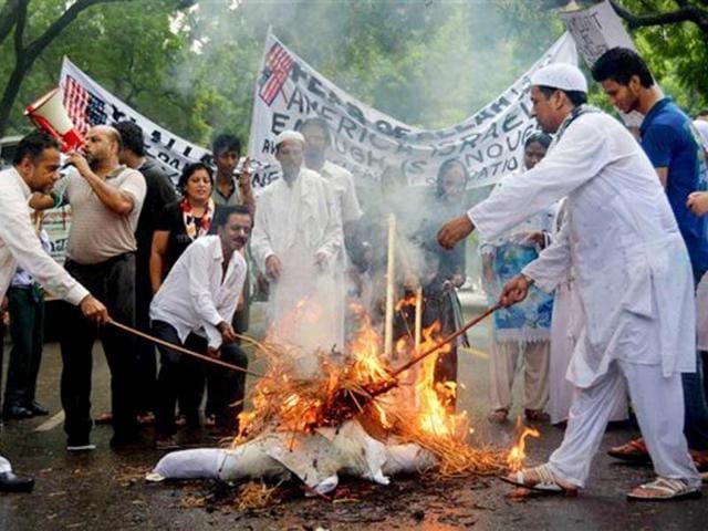 People stage a protest against Israeli attack on Gaza at Jantar Mantar on Sunday. (PTI Photo)