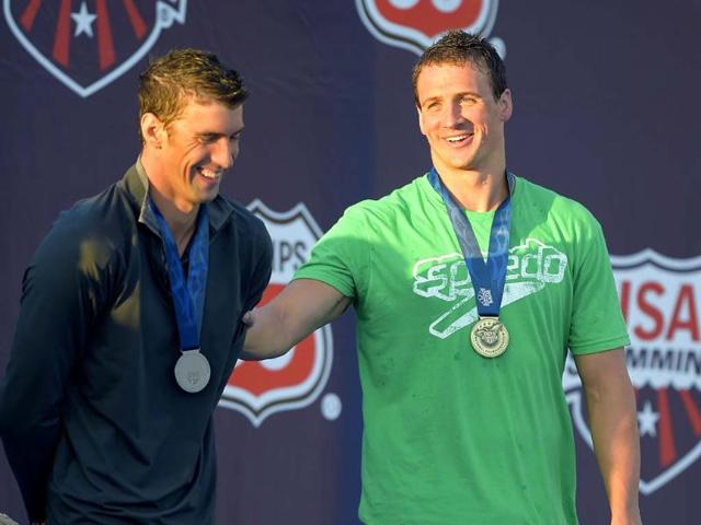 Ryan Lockte (R) jokes around with Michael Phelps during the medals ceremony in the men's 200-meter individual medley final at the US nationals of swimming in Irvine, California. (AP Photo)
