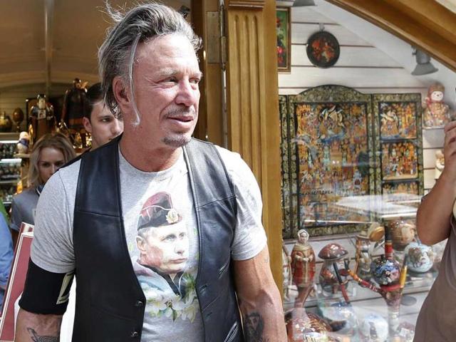 Actor-Mickey-Rourke-wears-a-T-shirt-with-an-image-depicting-Russia-s-President-Vladimir-Putin-as-a-woman-looks-on-at-GUM-department-store-in-central-Moscow-August-11-2014-REUTERS-Photo Actor-Mickey-Rourke-wears-a-T-shirt-with-an-image-depicting-Russia-s-President-Vladimir-Putin-as-a-woman-looks-on-at-GUM-department-store-in-central-Moscow-August-11-2014-REUTERS-Photo