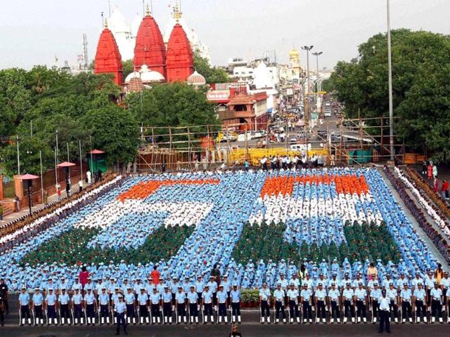 School children sit in a pattern that reads '68' during a rehearsal for the 68th Independence Day function at Red Fort in New Delhi. PTI Photo