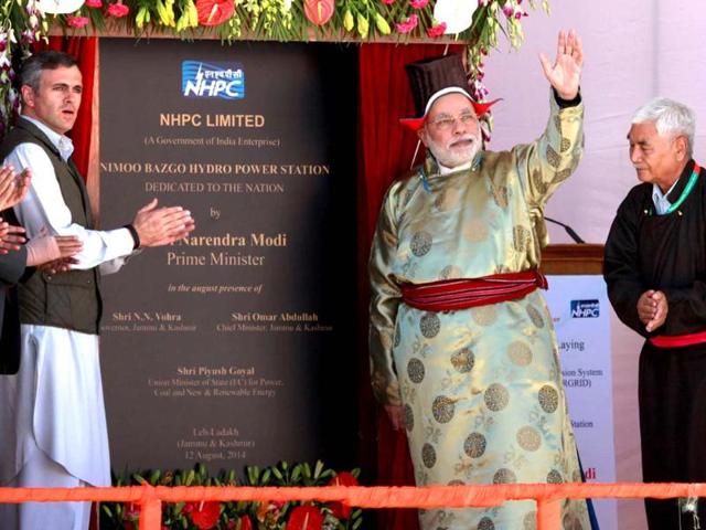 Prime Minister Narendra Modi (C) and the chief minister of Jammu and Kashmir Omar Abdullah (2L) take part in the opening of the Nimmo-Bazgo hydropower project in Leh. (AFP Photo/PIB)