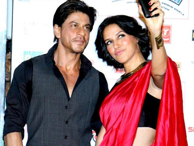 Neha Dhupia was on a selfie-spree at a recent promotional event for Ekkees Toppon Ki Salaami. Here, she poses with Shah Rukh Khan for the selfie. (PTI Photo)