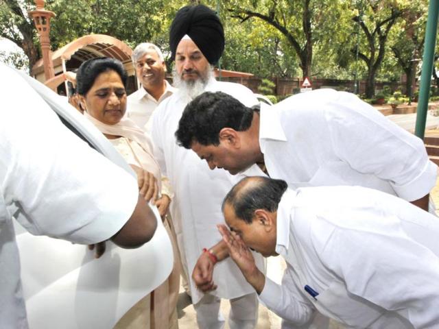 BSP Members of Parliament of Rajya Sabha touches the feet of party Supremo Mayawati at Parliament House in New Delhi. (Photo by Arvind Yadav/ Hindustan Times)