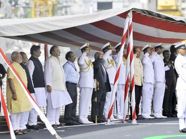 PM Narendra Modi along with Maharashtra governor K Shankarnarayanan, Maharashtra CM Prithviraj Chavan, defence minister Arun Jaitley and admiral RK Dhowan during the commissioning ceremony of INS Kolkata at the Naval Dockyard in Mumbai. (PTI photo)