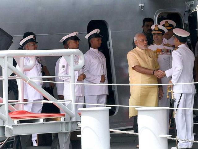 PM Narendra Modi and admiral RK Dhowan, chief of naval staff along with other naval officers during the commissioning ceremony of INS Kolkata at the Naval Dockyard in Mumbai. (PTI photo)