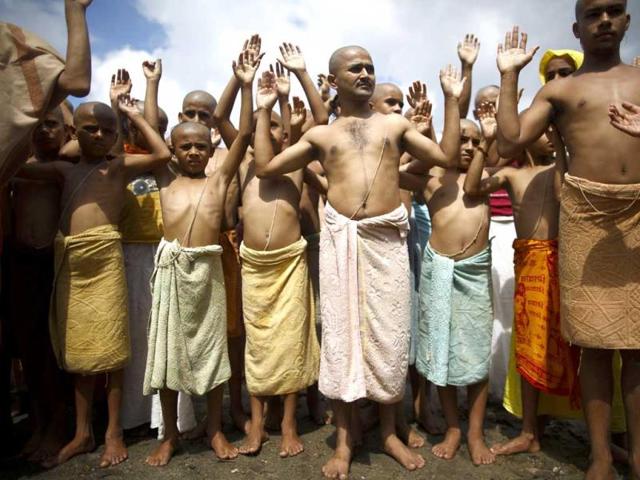 Hindu priests perform a ritual during the Janai Purnima festival (sacred thread festival) at the premises of Pashupatinath Temple in Kathmandu. (Reuters)