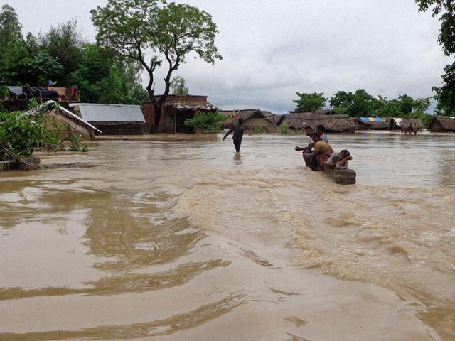 A-view-of-a-flooded-road-in-Tikonia-area-near-Indo-Nepal-border-in-Lakhimpur-Kheeri-Uttar-Pradesh-PTI-Photo A-view-of-a-flooded-road-in-Tikonia-area-near-Indo-Nepal-border-in-Lakhimpur-Kheeri-Uttar-Pradesh-PTI-Photo