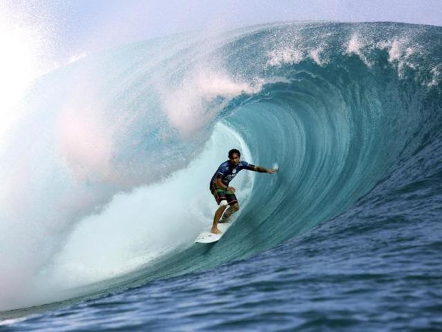 France's Taumata Puhetini rides a wave during the 14th edition of the Billabong Pro Tahiti surf event, part of the ASP (Association of Surfing Professionals) world tour, in Teahupoo, on the French Polynesian island Tahiti. (AFP Photo)