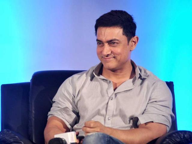 An amused Aamir Khan at the launch of 'Young Inspirators Network' in Mumbai on August 19, 2014. (AFP Photo)