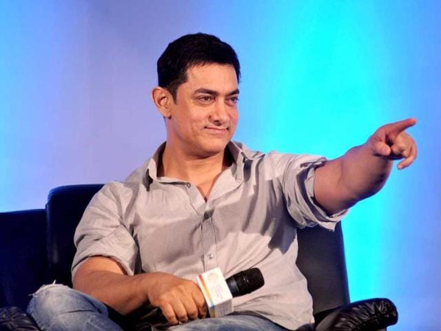 Happy to promote young talent: Aamir Khan points during the launch of Young Inspirators Network in Mumbai on August 19, 2014. (AFP Photo)