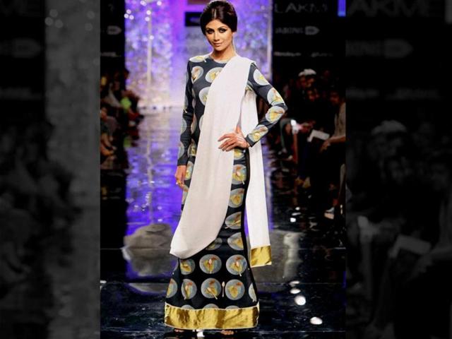 Shilpa Shetty walks the ramp for Masaba Gupta, looking stunning in an understated saree. (PTI Photo)