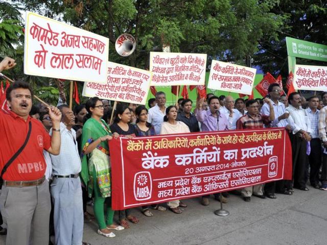 Bank employees association members stage a demonstration against the management's policies in front of Oriental Bank of Commerce, in Bhopal on Wednesday. (Praveen Bajpai/HT photo)