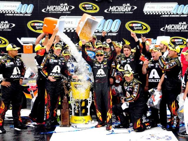 Jeff Gordon, driver of the #24 Axalta Chevrolet, and Alan Gustafson, his crew chief, participate in the ALS Ice Bucket Challenge after winning the NASCAR Sprint Cup Series Pure Michigan 400 at Michigan International Speedway. (AFP Photo)