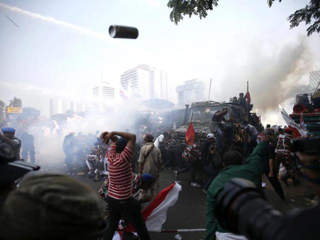 Indonesian police use tear gas and water cannon to disperse supporters of presidential candidate Prabowo Subianto during a protest near the Constitutional Court in Jakarta. (Reuters Photo)