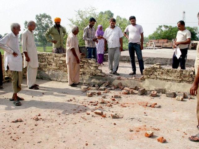 Villagers-show-marks-of-mortar-shells-after-firing-from-Pakistan-s-side-in-Treva-village-at-India-Pakistan-International-border-in-Arnia-Sector-Jammu-PTI-Photo