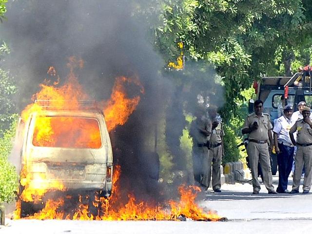 A van catches Fire at Safdarjung Road near Jor Bagh Metro Station no one injured or hurt in the incident, later fire services personnel doused the fire in New Delhi. (HT Photo/Vipin Kumar)