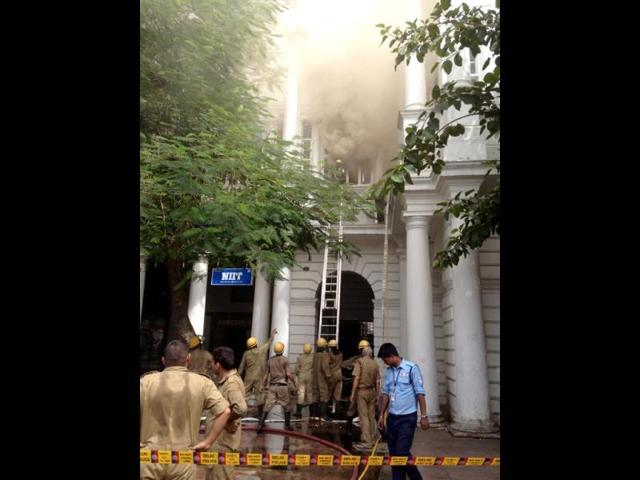Fire-personnel-try-to-douse-flames-coming-out-of-NIIT-computer-training-institute-in-A-block-Connaught-Place-after-it-caught-fire-on-Monday-Osama-Salman-HT-Photo
