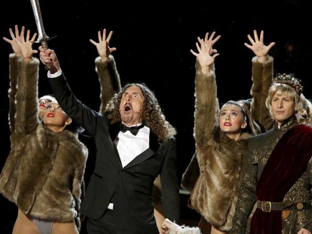 Weird Al Yankovic's spoof of Game of Thrones with Andy Samberg (R). The chorus sang, “Don’t get too attached to a certain guy/(have a backup)/he might drink some poison wine/(that’s a spoiler!)” (Reuters)